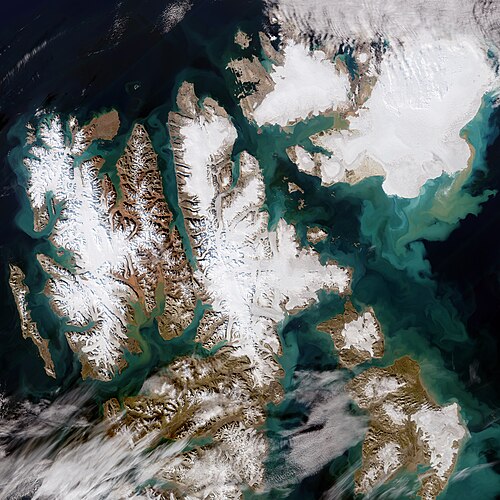 Svalbard Islands under Norwegian control for resource security and strategic positioning in the Arctic.
