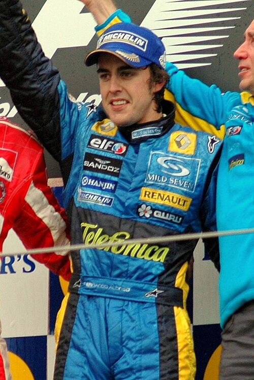 Fernando Alonso becomes F1's youngest world champion by defeating Kimi Räikkönen in Brazil.