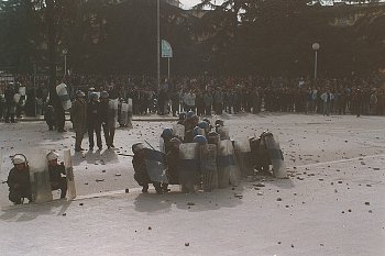 Pyramid schemes collapse, causing financial losses and sparking protests against the government.
