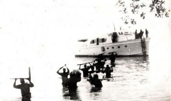Lands in Cuba on yacht 'Granma.' 12 survivors regroup in Sierra Maestra to launch guerrilla war.