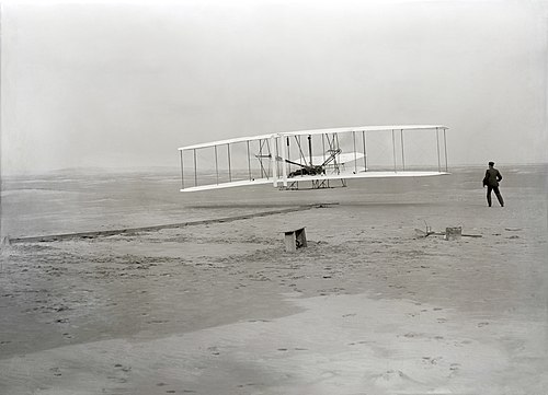 Moment image for Wright brothers achieve powered flight milestone in Kitty Hawk, North Carolina.