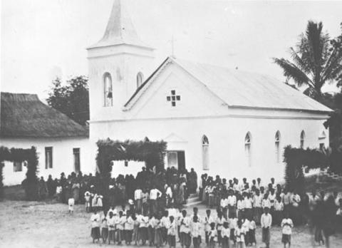 Moment image for Portuguese missionaries convert indigenous Timorese to Christianity in historical context.