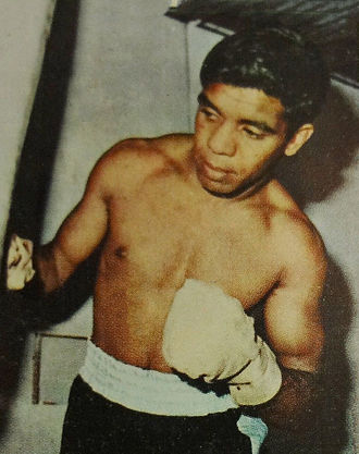 Moment image for Aboriginal boxing champion Lionel Rose defeats Masahiko "Fighting" Harada in Japan to become the world bantamweight champion.
