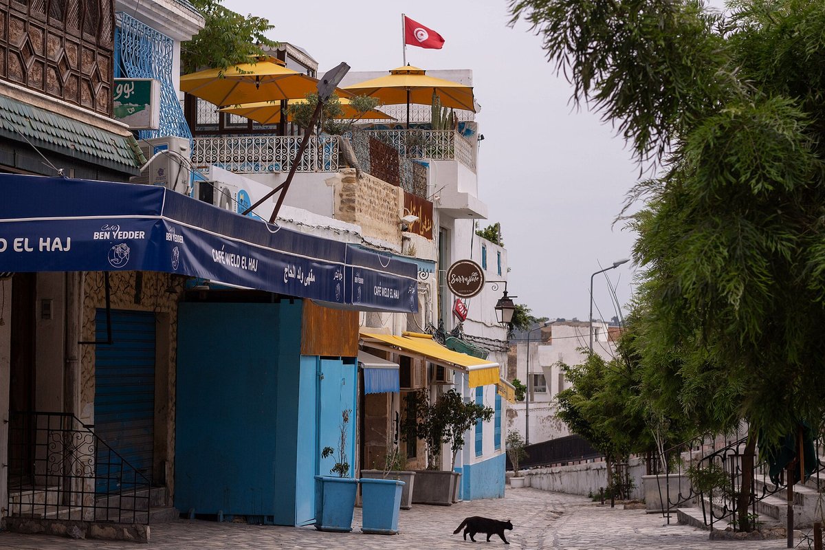 Moment image for Rising COVID-19 cases in Tunisia prompt new government restrictions and containment measures.