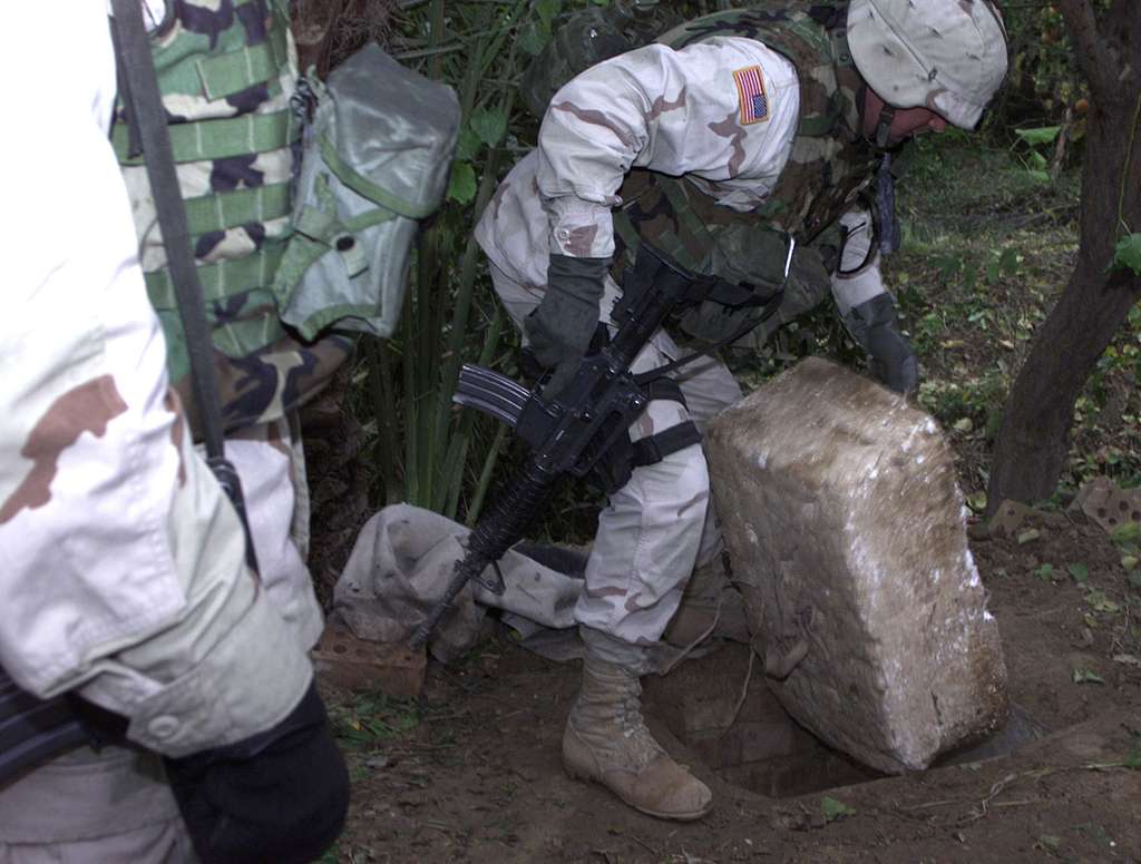 Moment image for US forces capture Saddam Hussein near Tikrit hometown, ending a manhunt for the former leader.