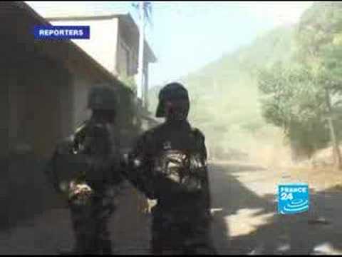 Moment image for AU and Comoran troops recapture Anjouan; France detains leader Mohamed Bacar.
