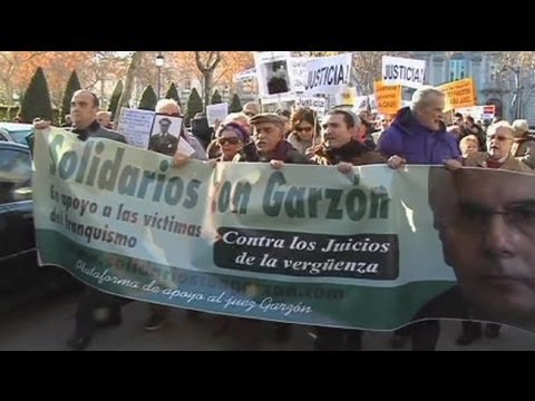 Moment image for Garzón faces criminal charges in three cases, sparking international scandal and protests.