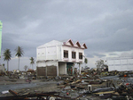 Deadly earthquake and tsunami devastate Aceh.